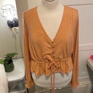 Coral orange peplum pol blouse knit top